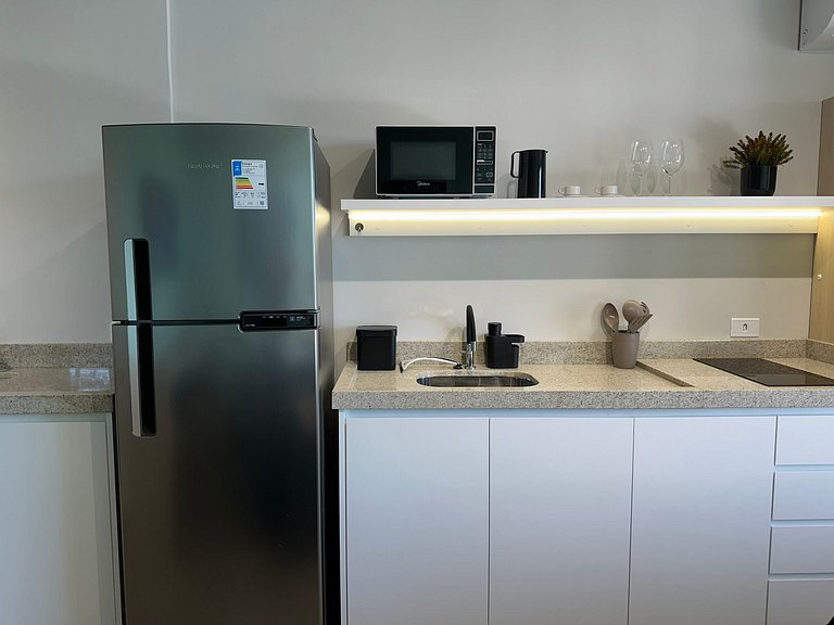 Studio 1301 com sacada, garagem e A/C