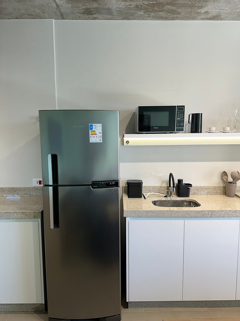 Studio 1301 com sacada, garagem e A/C