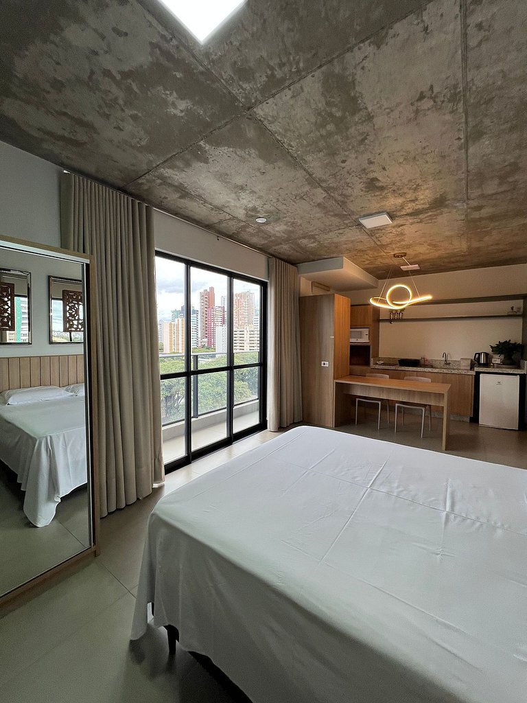 Studio 802 com sacada, garagem e A/C