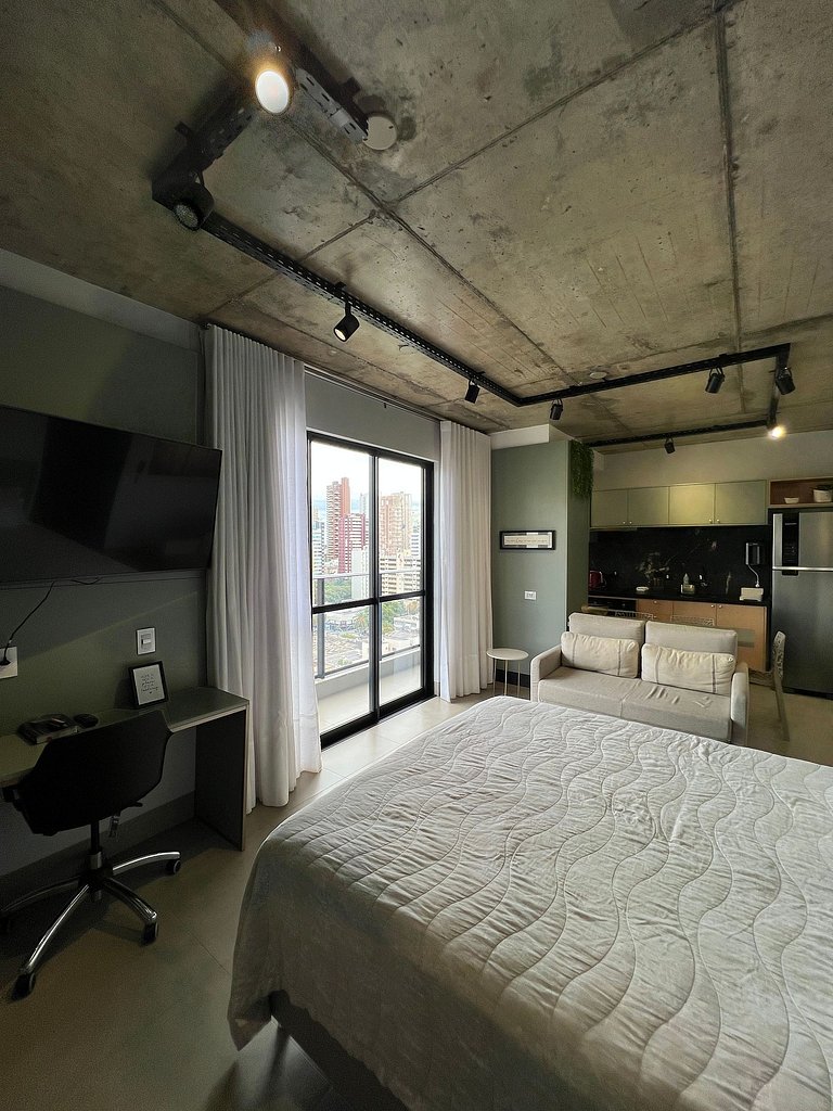 Studio 1402 com sacada, garagem e A/C
