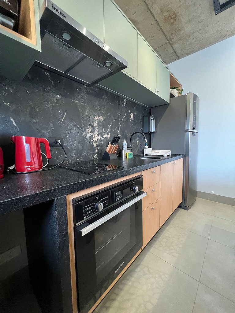 Studio 1402 com sacada, garagem e A/C